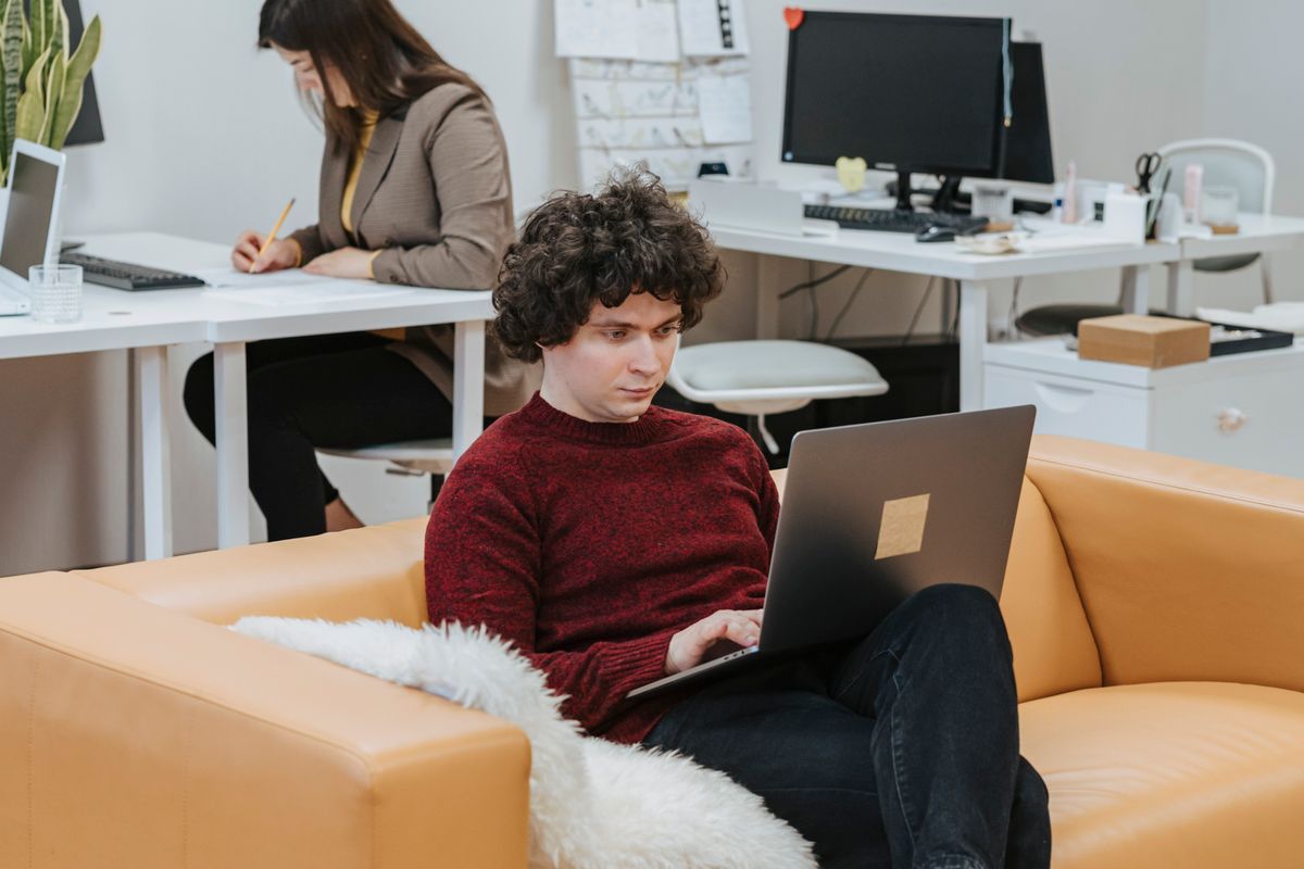 Two people reviewing a screen